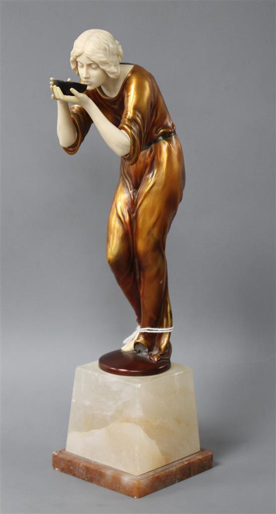 An Art Deco style resin figure of a lady, height 28cm